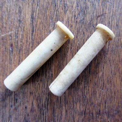 c1900 pair of hand carved bone knitting needle tips or guards