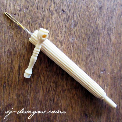 c1880 carved bone parasol needle case