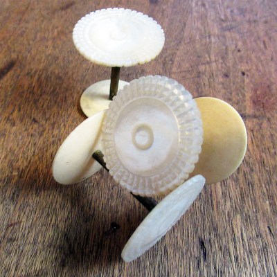 19th century carved mother of pearl spool holders (matched set of 3)